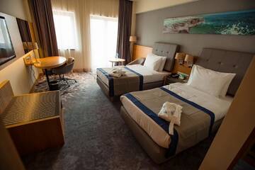 Фото номера Делюкс с 2 кроватями - Для некурящих Отель Holiday Inn - Aktau - Seaside г. Актау 12